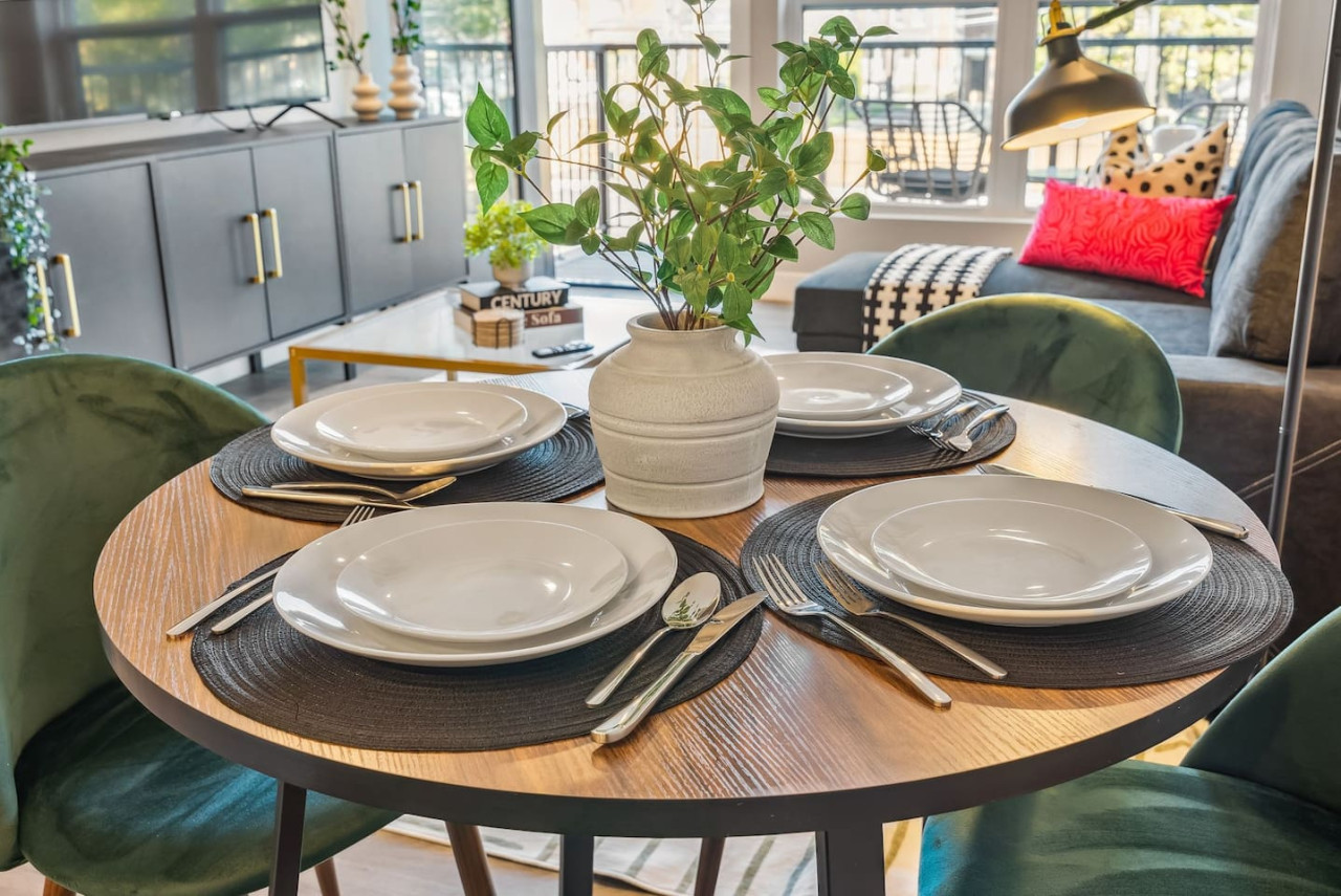 The dining room is bathed in natural light, creating a bright and inviting space where every meal feels special.