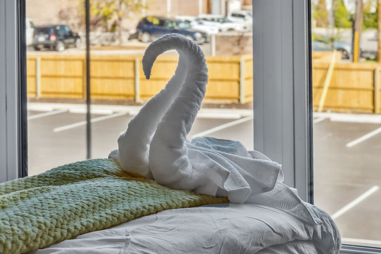 The queen bedroom’s stylish design and comfortable bedding create a perfect sanctuary for restful nights.