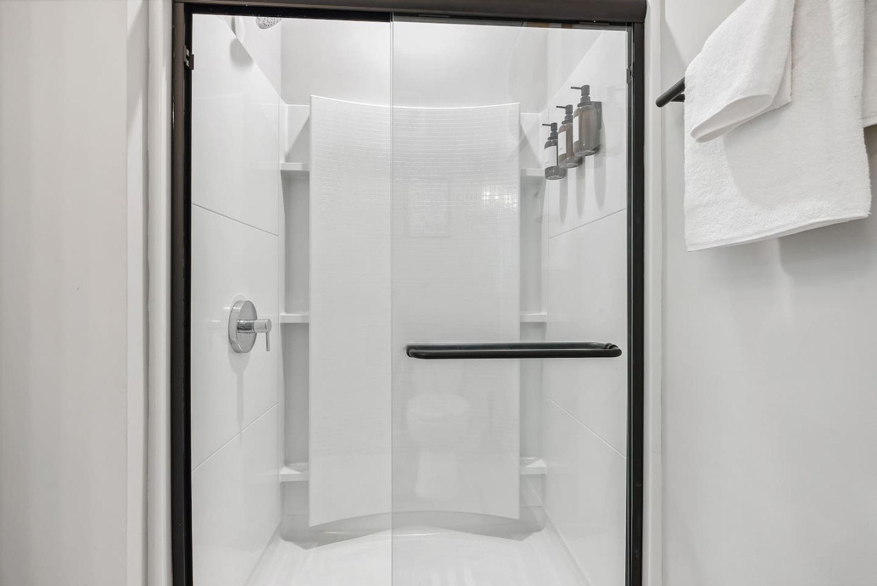 You feel a sense of calm as you enter the bathroom, where the thoughtful design and high-quality materials create a serene environment.