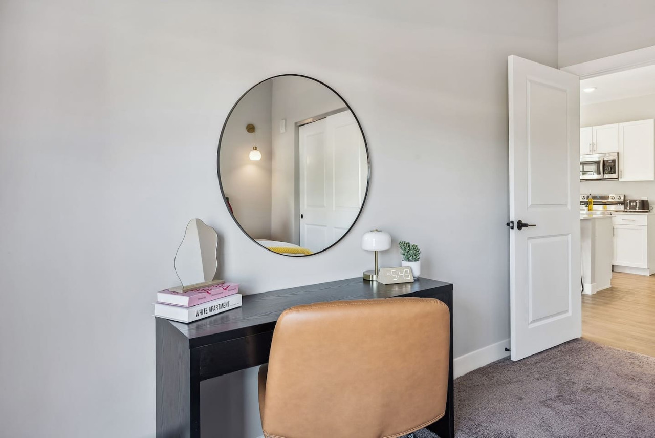 This cozy workspace with warm lighting, and a creative wall display, perfect for productivity.