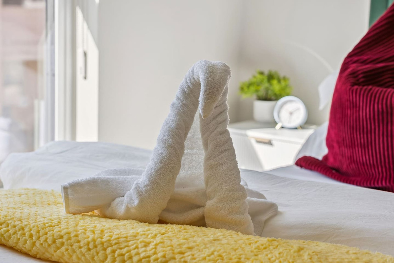The queen bedroom’s stylish design and comfortable bedding create a perfect sanctuary for restful nights.