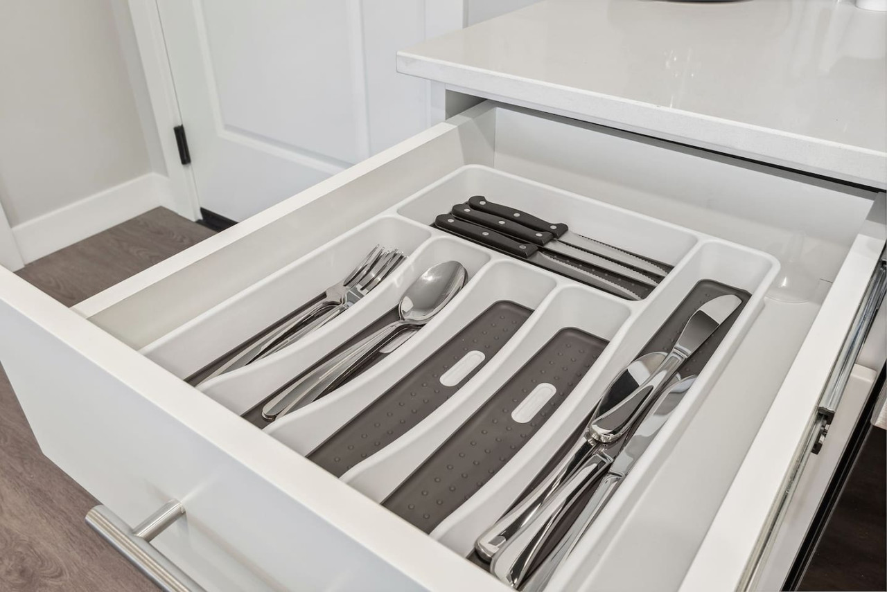 Kitchen utensils with scissors, measuring cups, grater, wine opener, can opener