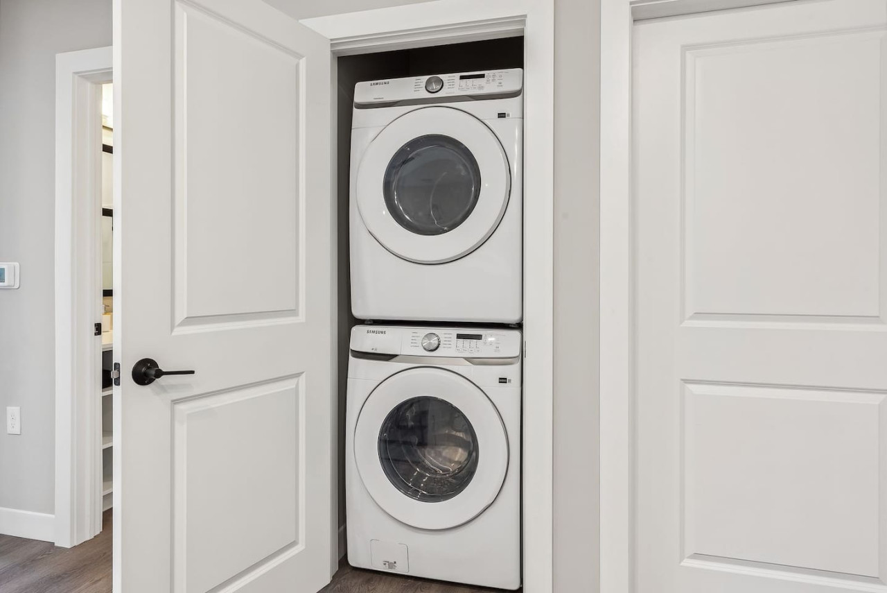 Convenient laundry room with washer, dryer, and all necessary supplies, making it easy to take care of your laundry needs.