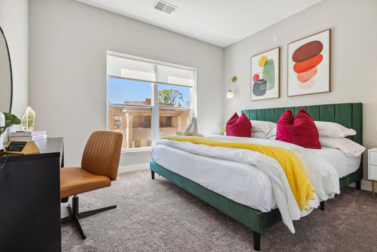 The king bed is the centerpiece of the room, offering a plush and inviting space where you can rest and recharge.