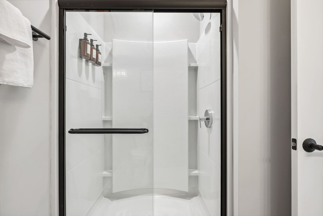 You feel a sense of calm as you enter the bathroom, where the thoughtful design and high-quality materials create a serene environment.