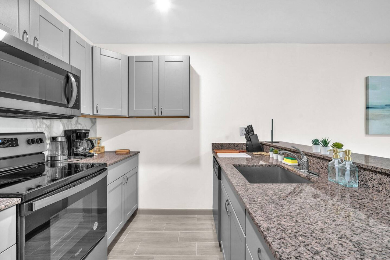 You’ll love the convenience of this fully equipped kitchen, where you can brew coffee, cook meals, or prepare snacks. The cozy layout and warm ambiance make cooking here a delightful part of your stay.