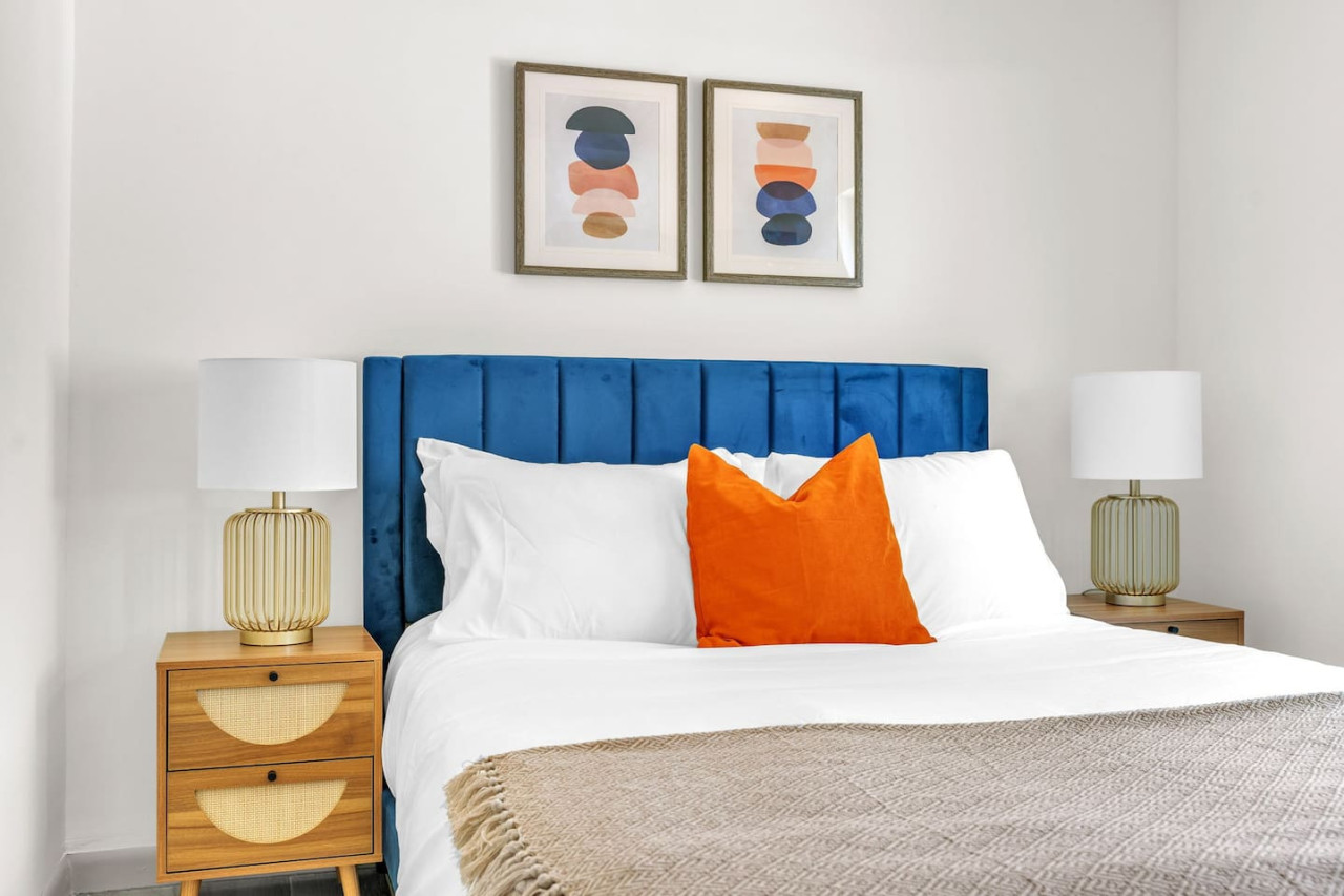 Abstract art above the bed.