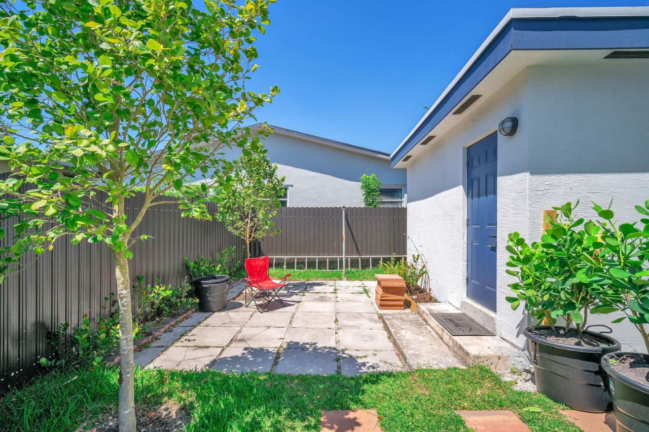 A cozy backyard area with a tiled patio.