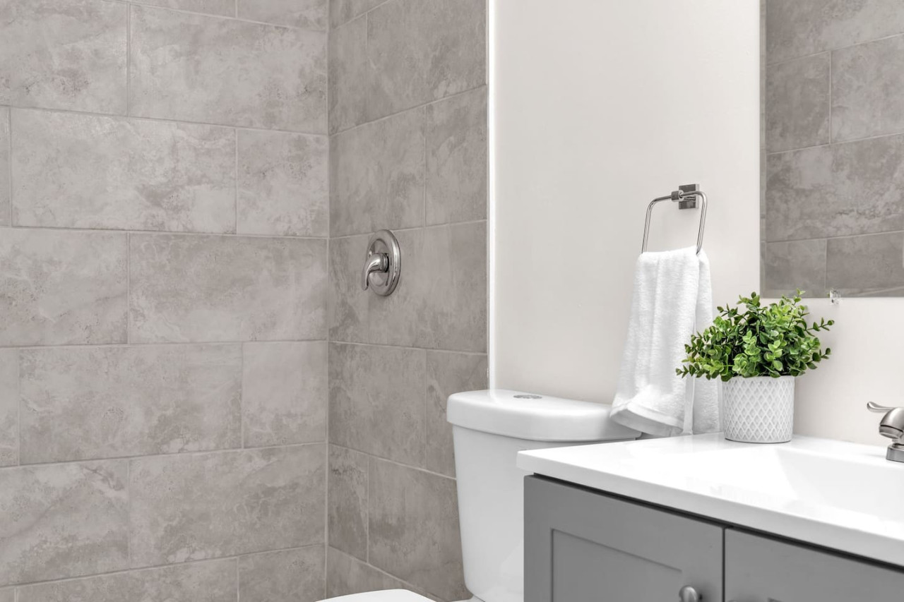 Elegant washroom design with grey-toned tiles