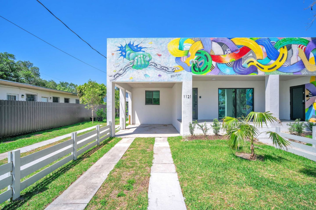 As you approach the house, the inviting entrance and beautiful exterior make you eager to explore what’s inside.