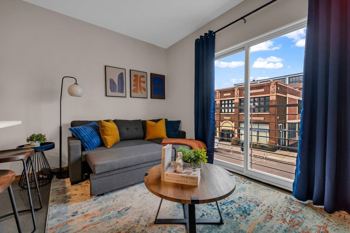As you take a seat in the liviThe living room is filled with natural light, creating a bright and welcoming space that invites relaxation.ng room, the comfortable furniture and tasteful design make it easy to unwind.