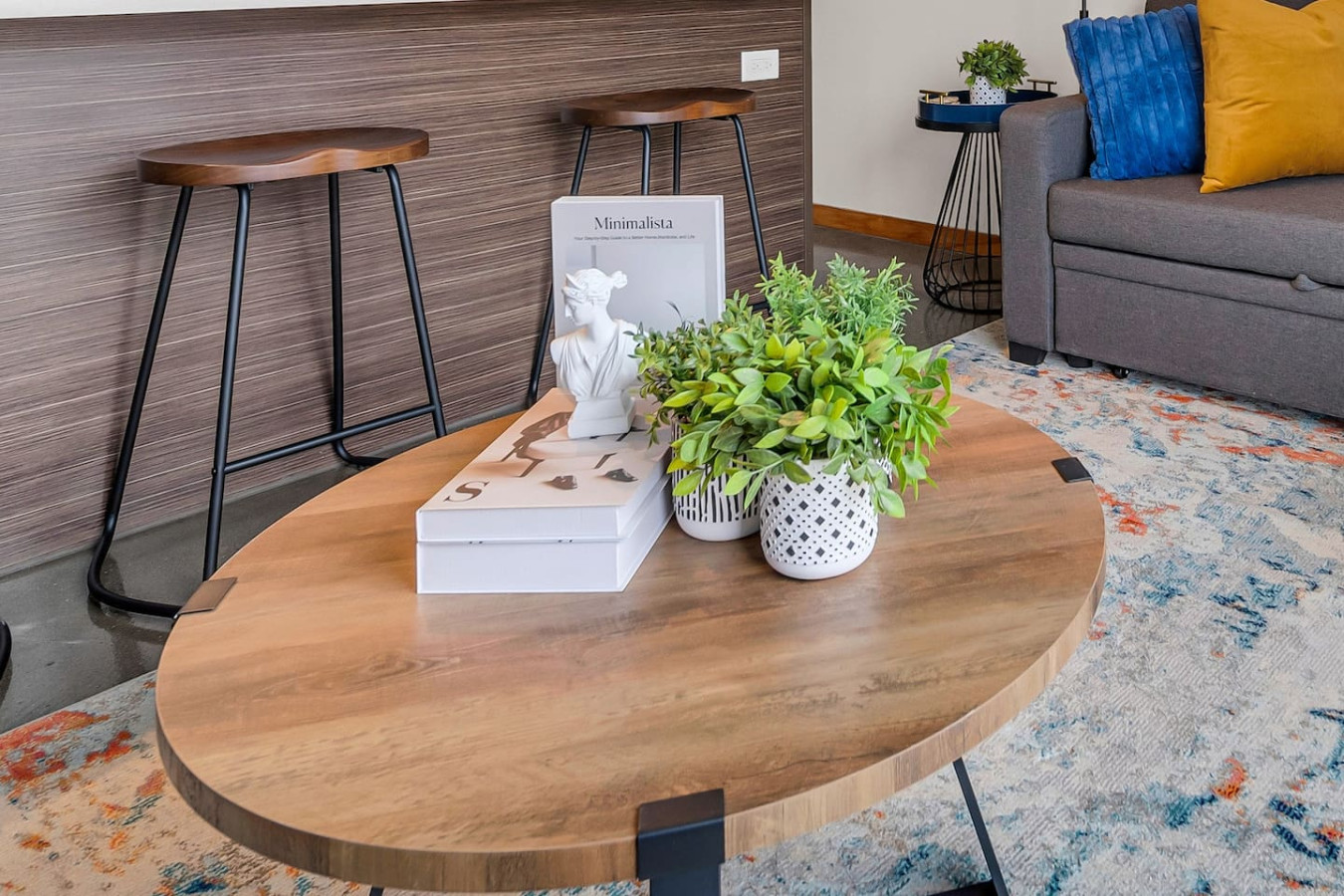 The living room is filled with natural light, creating a bright and welcoming space that invites relaxation.