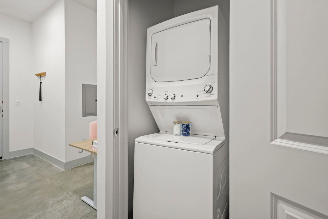 As you step into the laundry room, the modern appliances and ample storage space make it easy to keep things tidy.