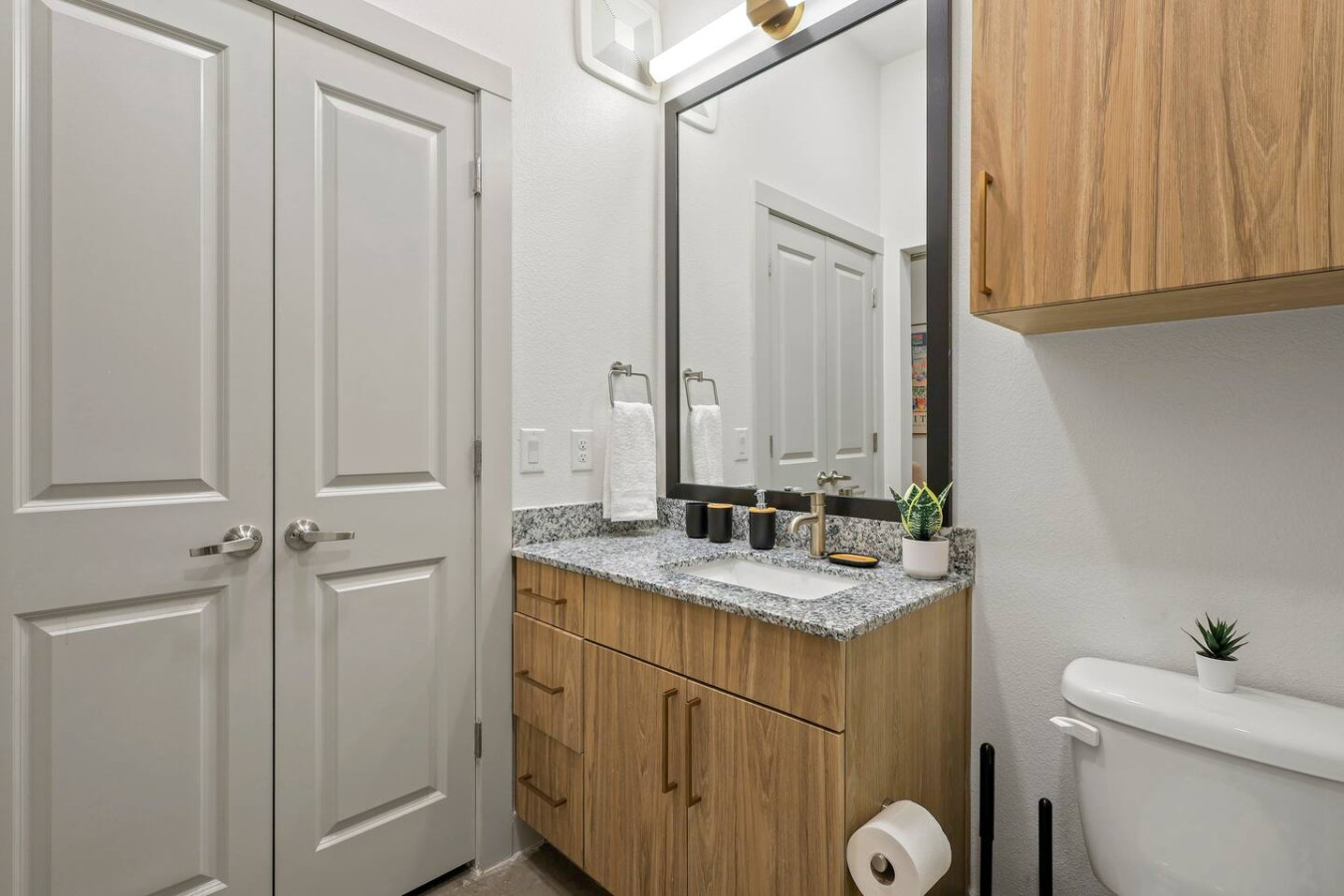 You feel a sense of calm as you enter the bathroom, where the thoughtful design and high-quality materials create a serene environment.