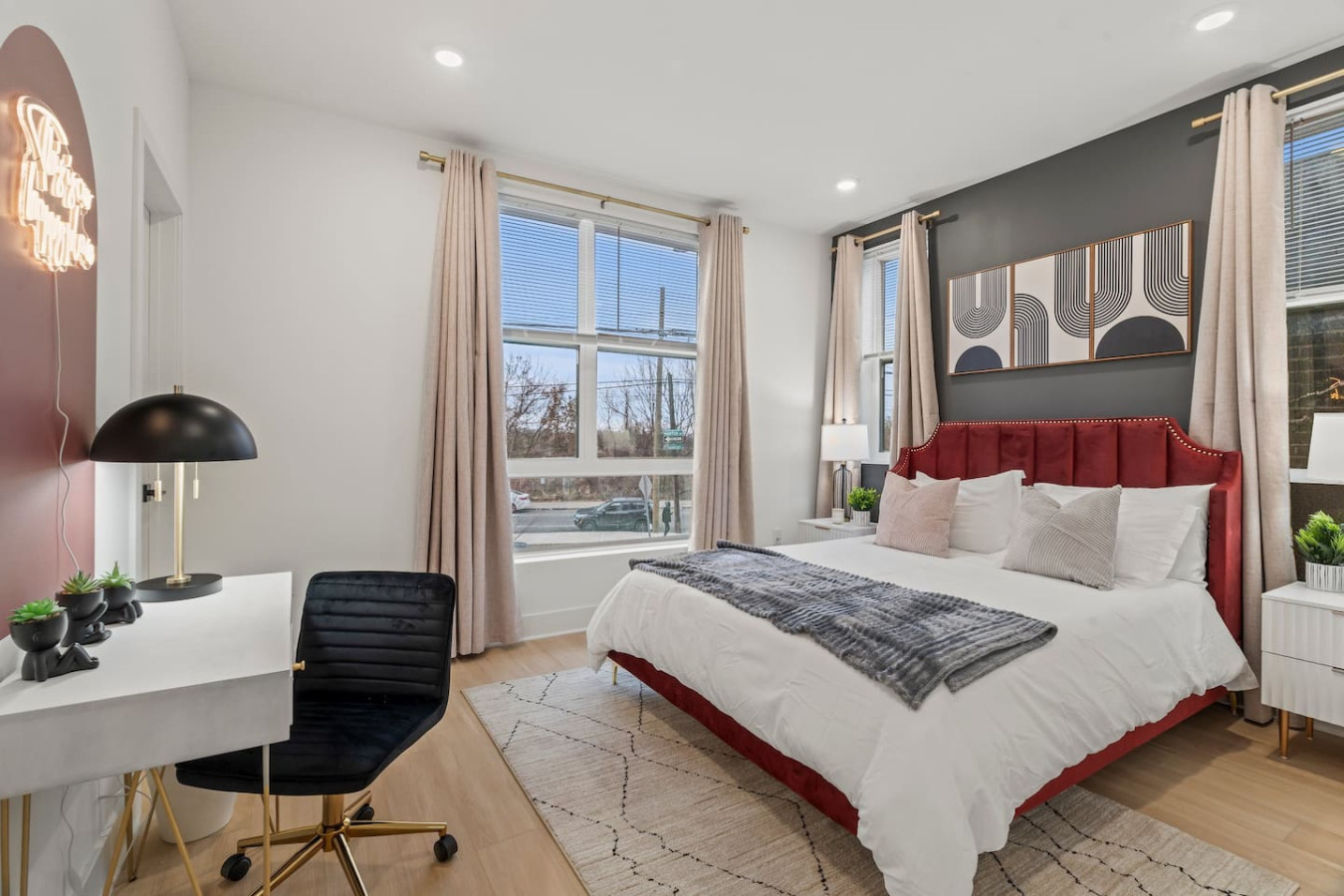 Luxurious bedroom featuring a comfortable bed, elegant decor, and plenty of natural light for a rejuvenating sleep.