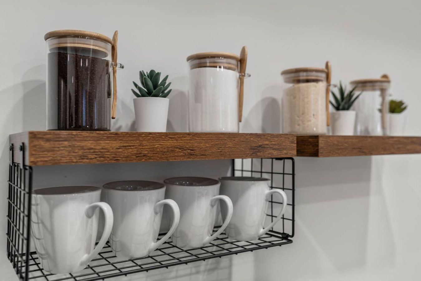 Kitchen cabinets stocked with cooking wares, glassware and silverwares, ideal for mixing up your favorite meals and drinks during your stay.