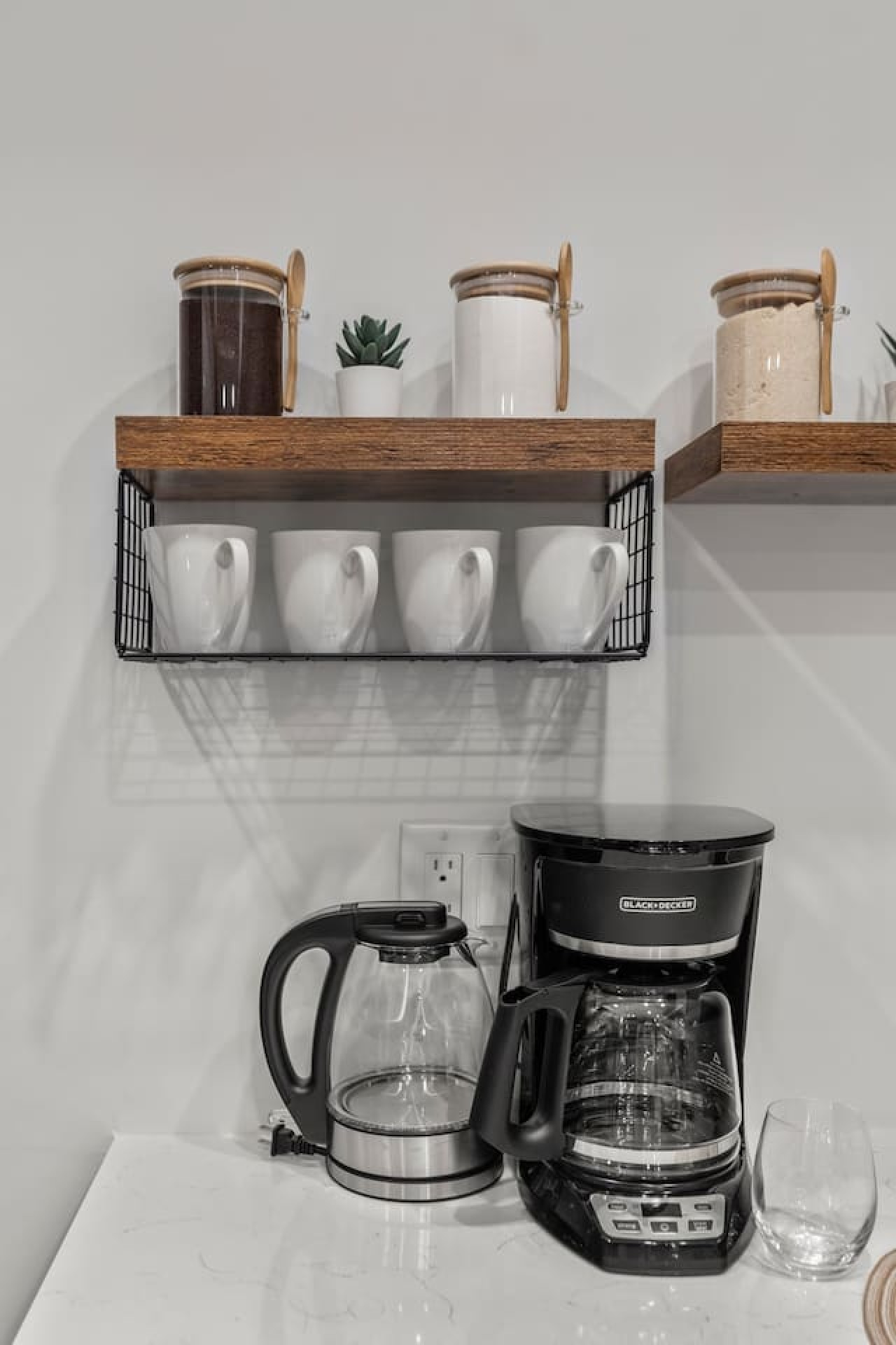 Kitchen cabinets stocked with cooking wares, glassware and silverwares, ideal for mixing up your favorite meals and drinks during your stay.
