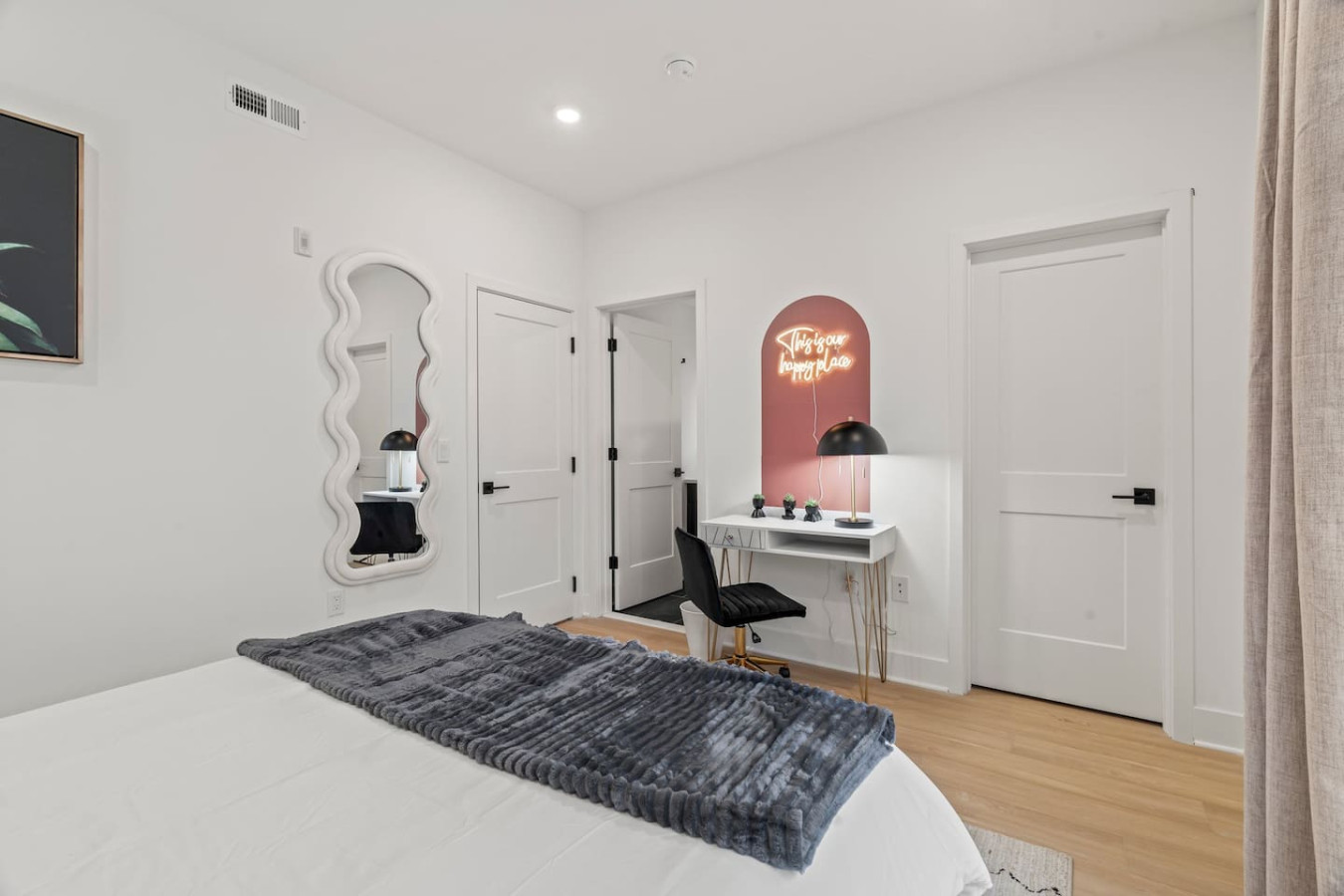 Spacious bedroom with stylish decor, perfect for unwinding after a day of exploring the local area.