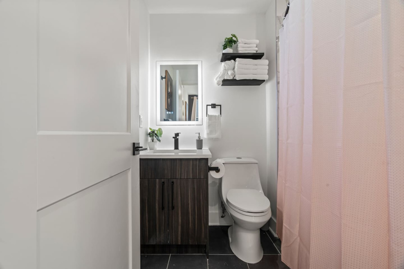 Full Bathroom with Single Vanity & Backlit Mirror