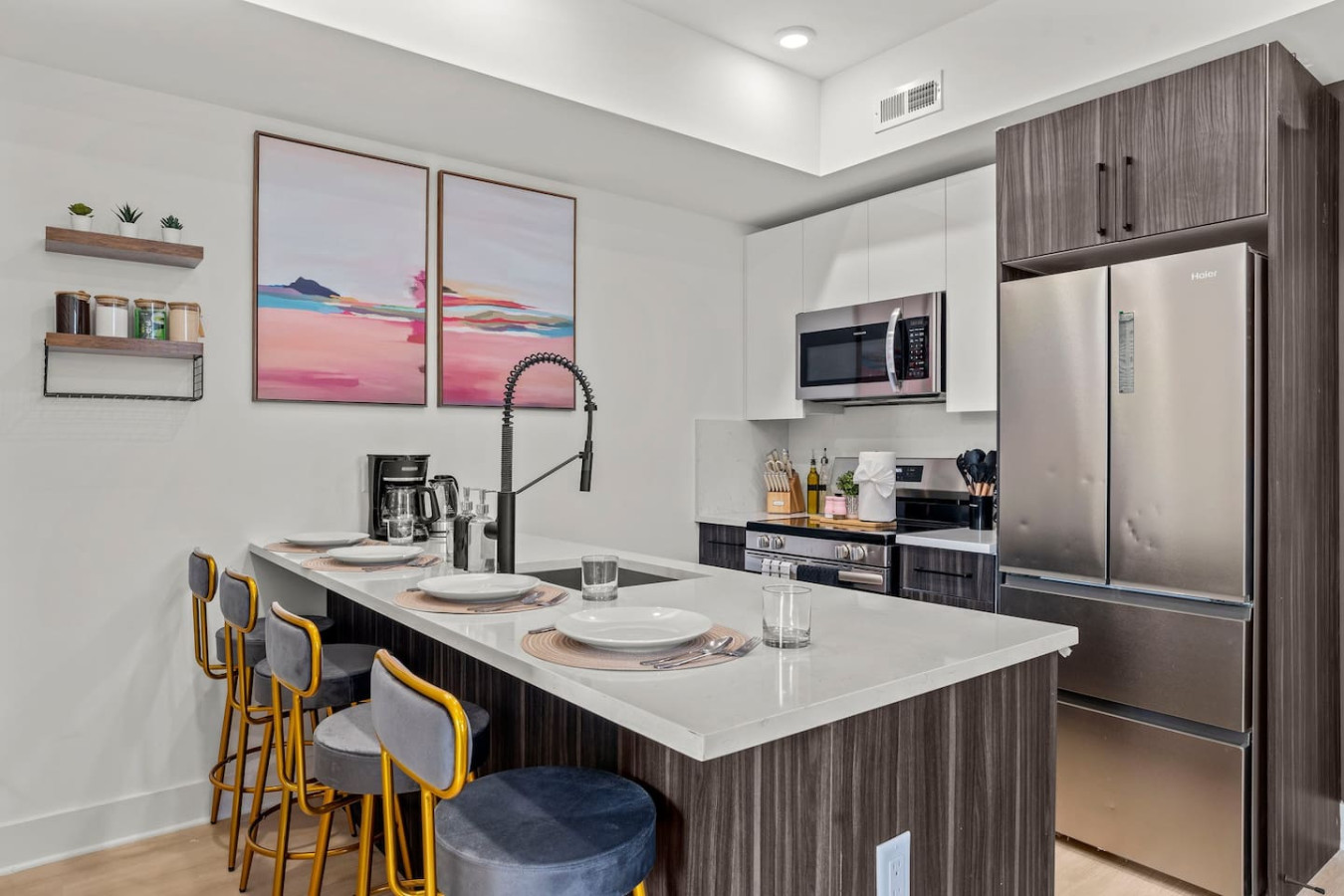 Fully Equipped Kitchen with Counter Height Seating for Four. Stainless steel appliances. Outlet on Island for Charging Devices / Working