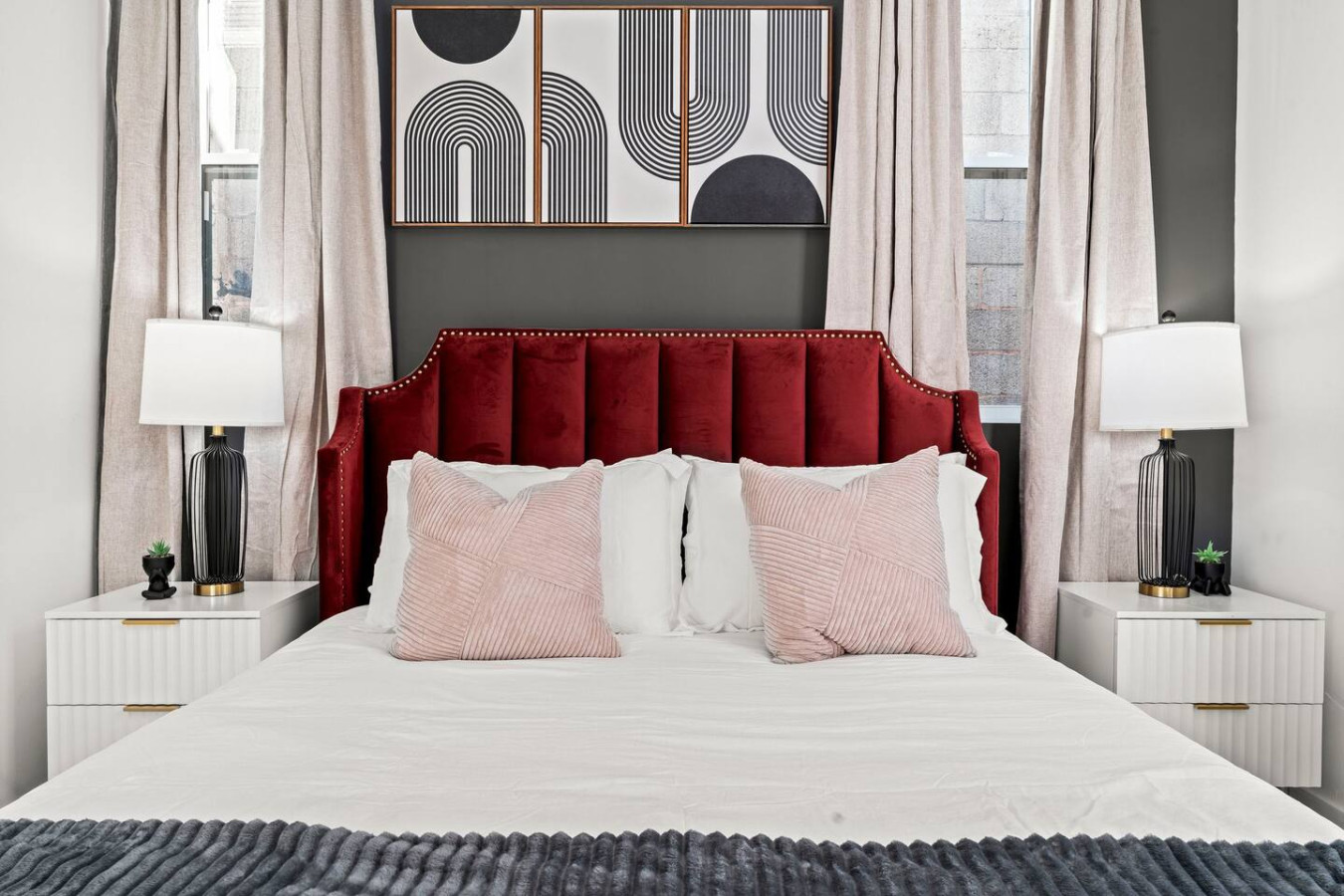 Luxe Bedroom with Queen Size Bed, Side Tables, and Table Lamps. Ample Natural Lighting with Blinds & Blackout Curtains for a restful sleep