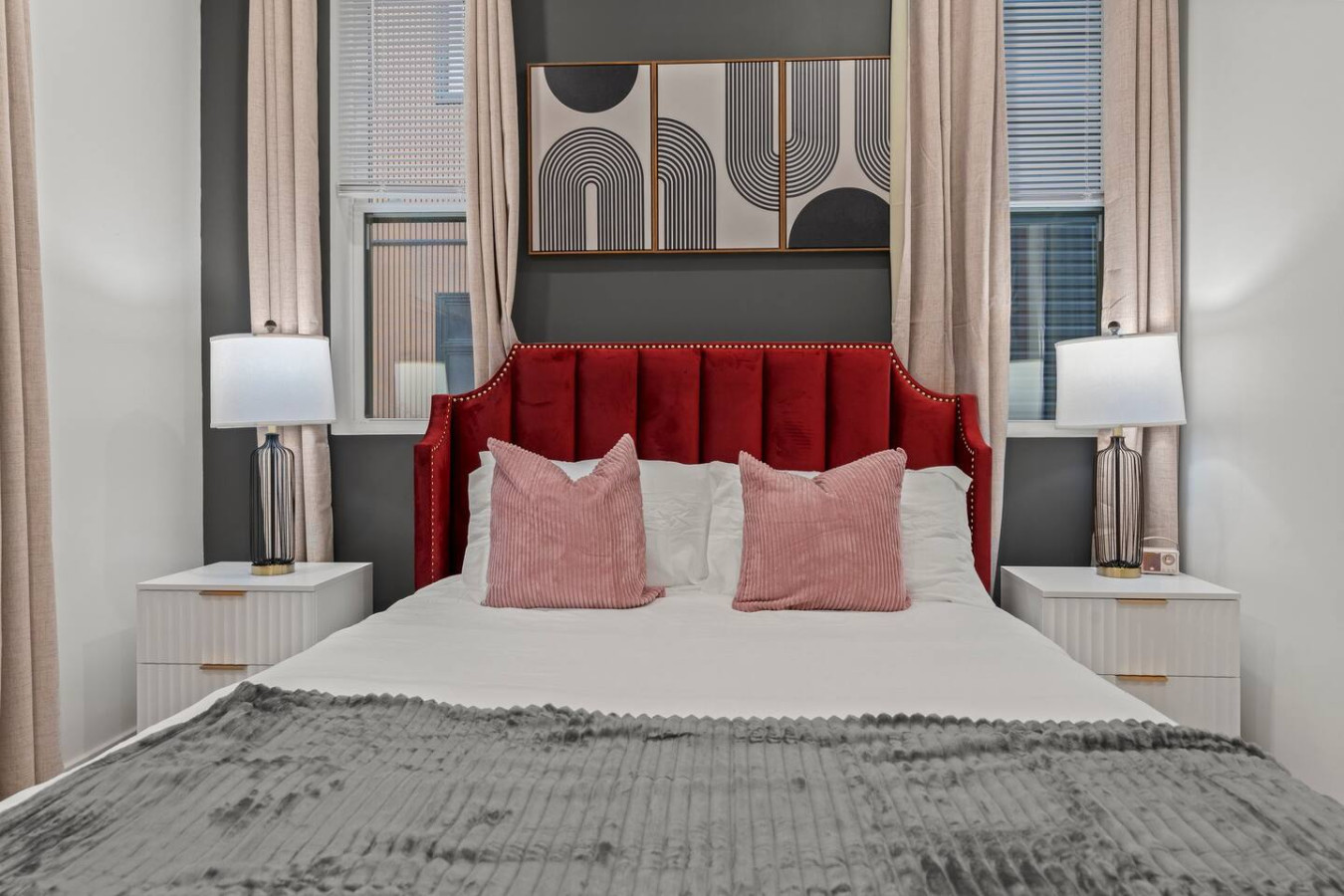 Queen-size bed with comfortable pillows + side-tables/lamps