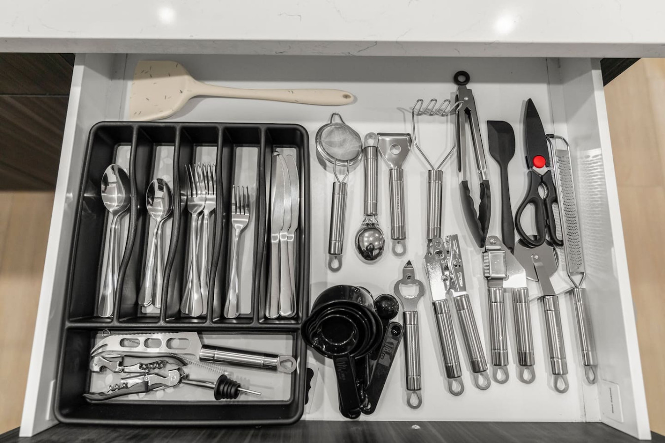 Everything you need in the kitchen: flatwares, strainer, spatula, tongs, scissor, measuring spoons, and more!