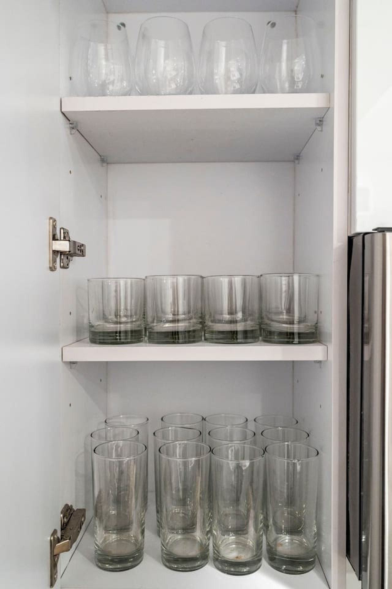 A set of glasses in the kitchen for your drinks.