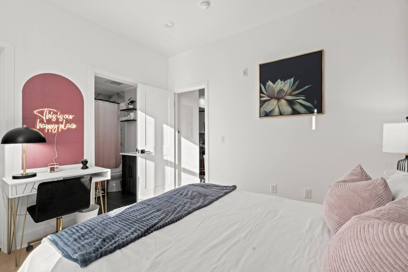 Spacious master bedroom with direct access to your private bathroom, closet, and dedicated workspace.