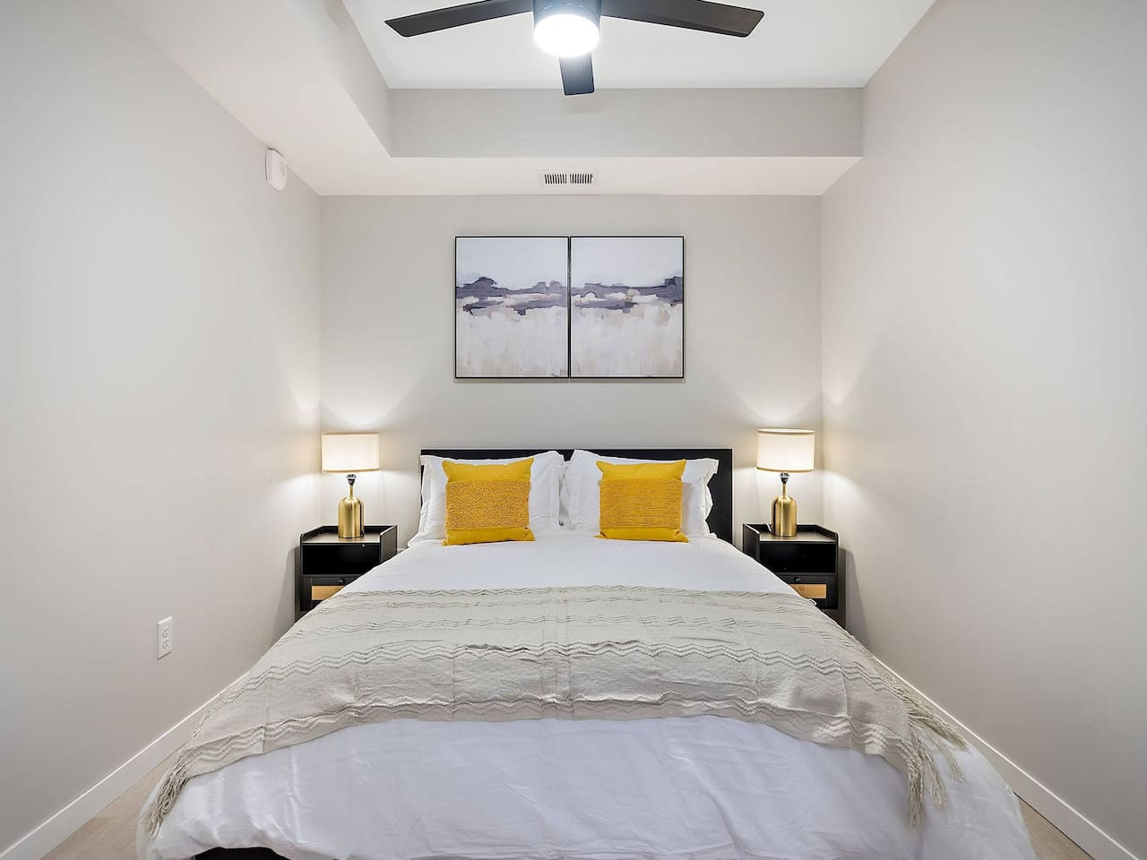 The bedroom offers a luxurious retreat, with a bed that promises restful nights and a room that feels like a private oasis.
