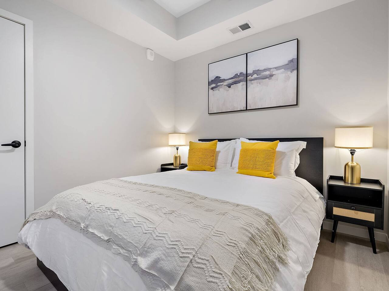 The bedroom offers a luxurious retreat, with a bed that promises restful nights and a room that feels like a private oasis.