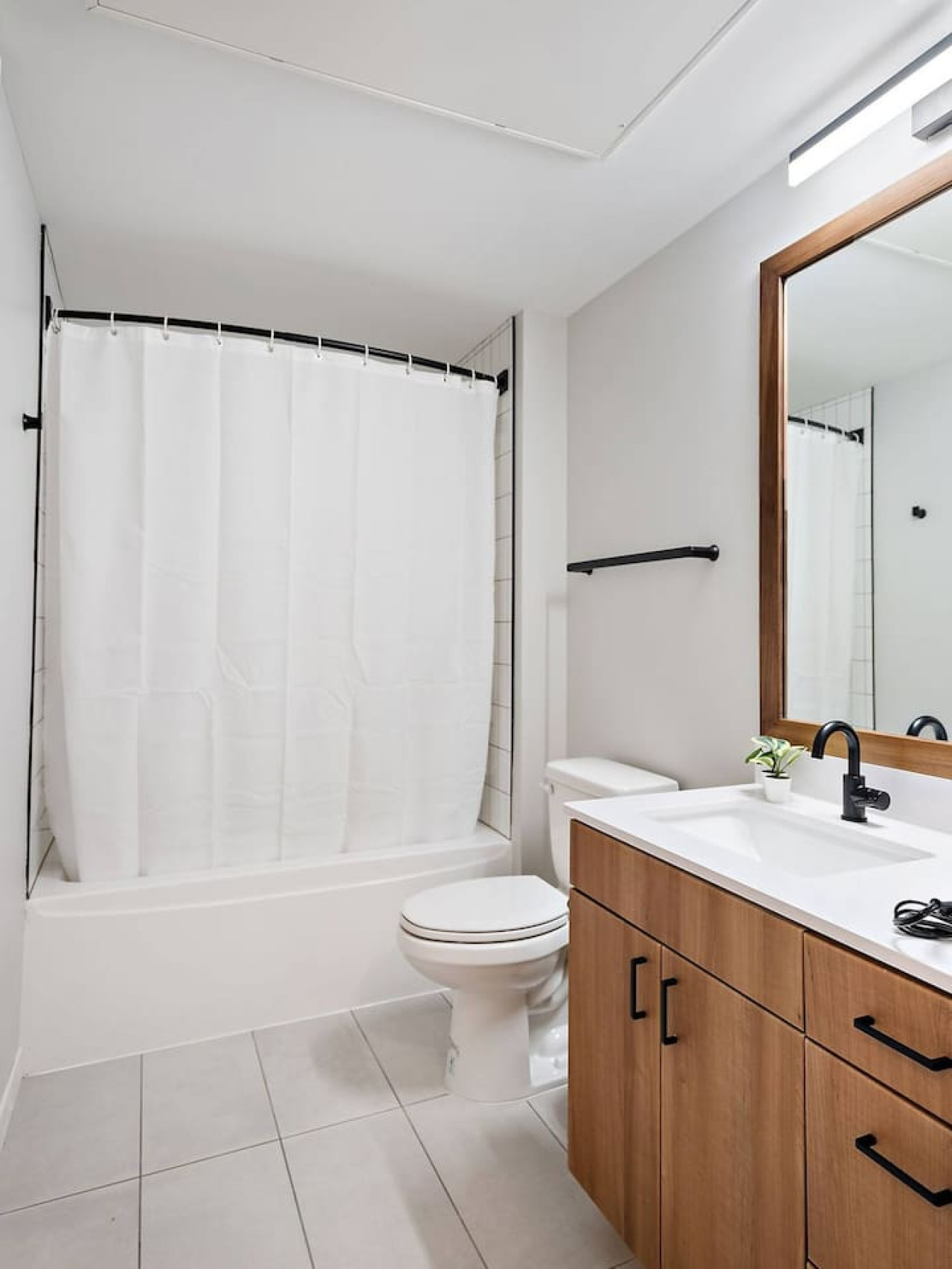 Experience a spa-like retreat in this beautifully appointed bathroom, featuring a full tub, modern fixtures, and thoughtful details. Refresh and rejuvenate with our luxury toiletries and plush towels.