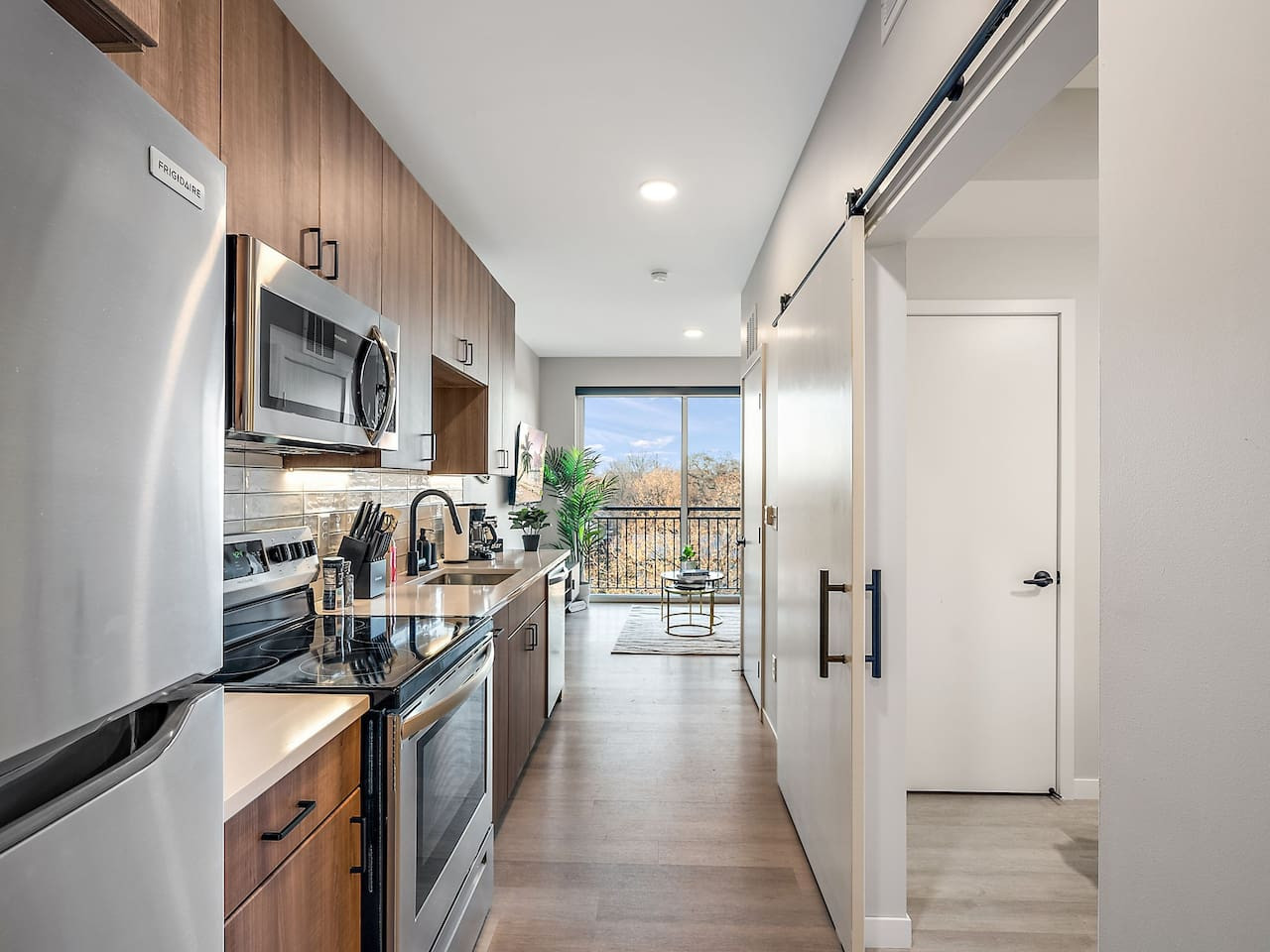 The kitchen’s open layout allows you to move freely as you prepare meals, with everything you need at your fingertips.