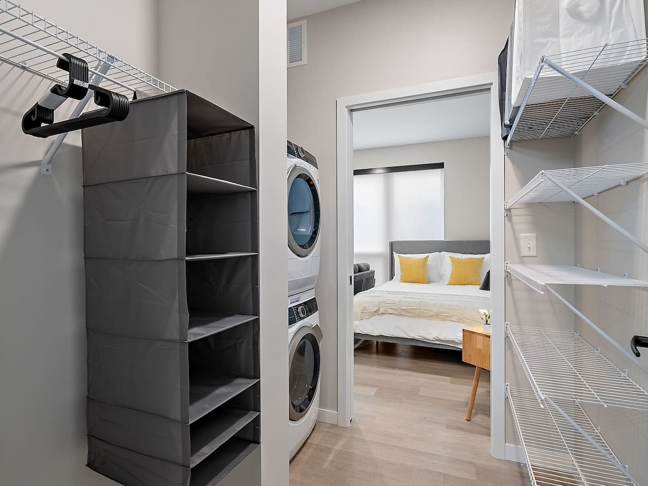 As you step into the laundry room, the modern appliances and ample storage space make it easy to keep things tidy.