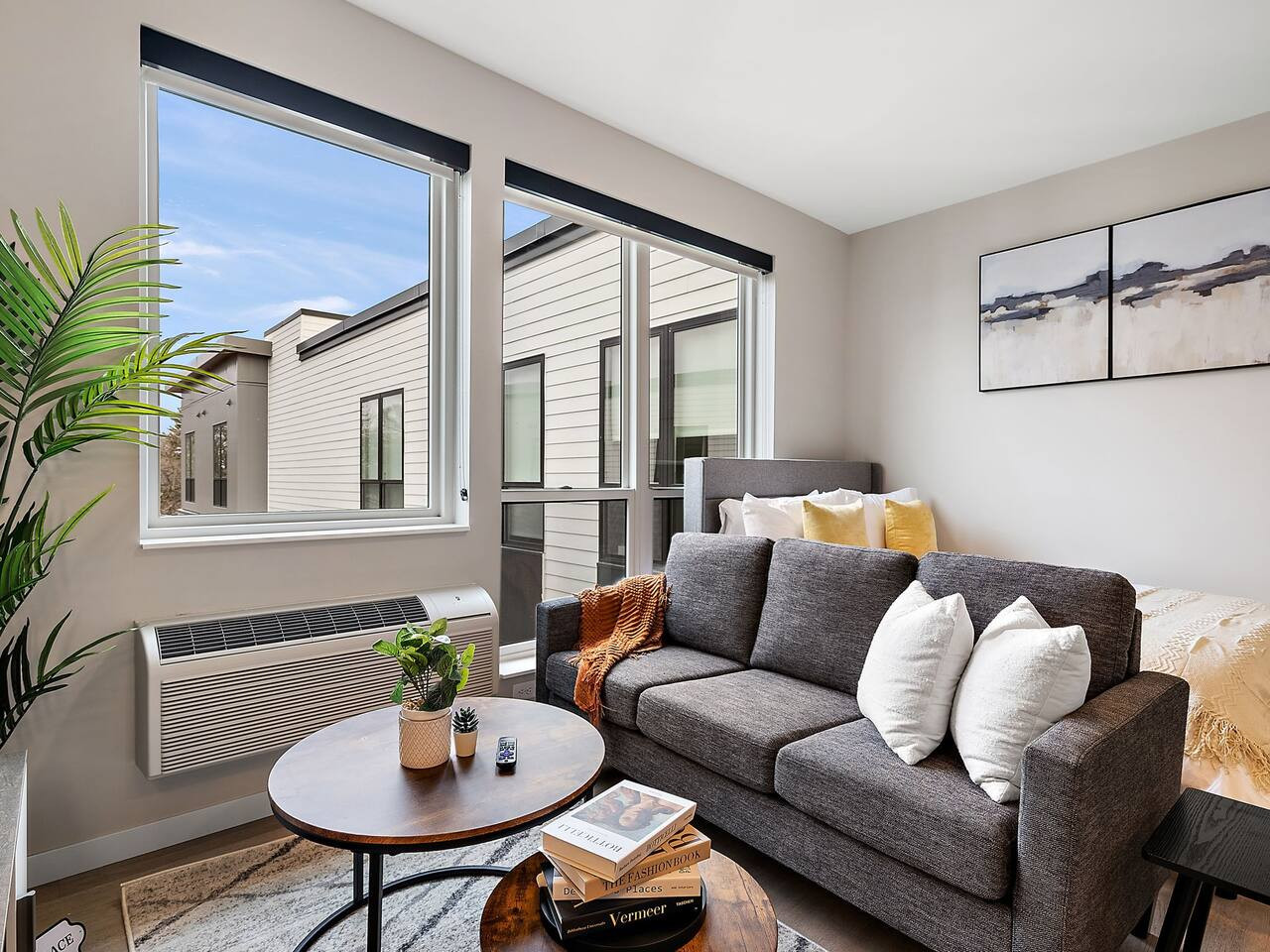 The living room is filled with natural light, creating a bright and welcoming space that invites relaxation.