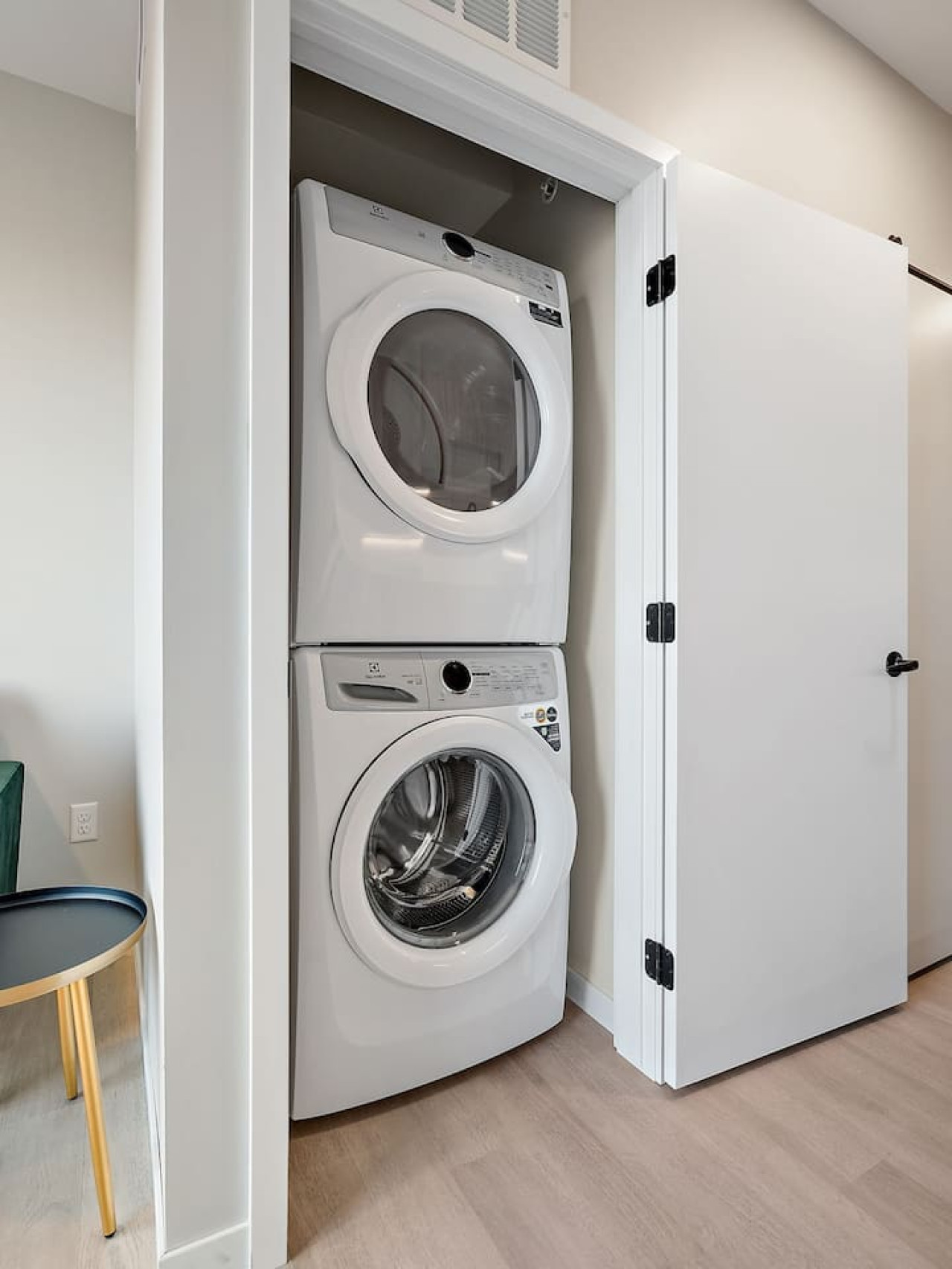 Laundry room with a washer, dryer, and folding area, offering all the convenience you need for a comfortable extended stay.