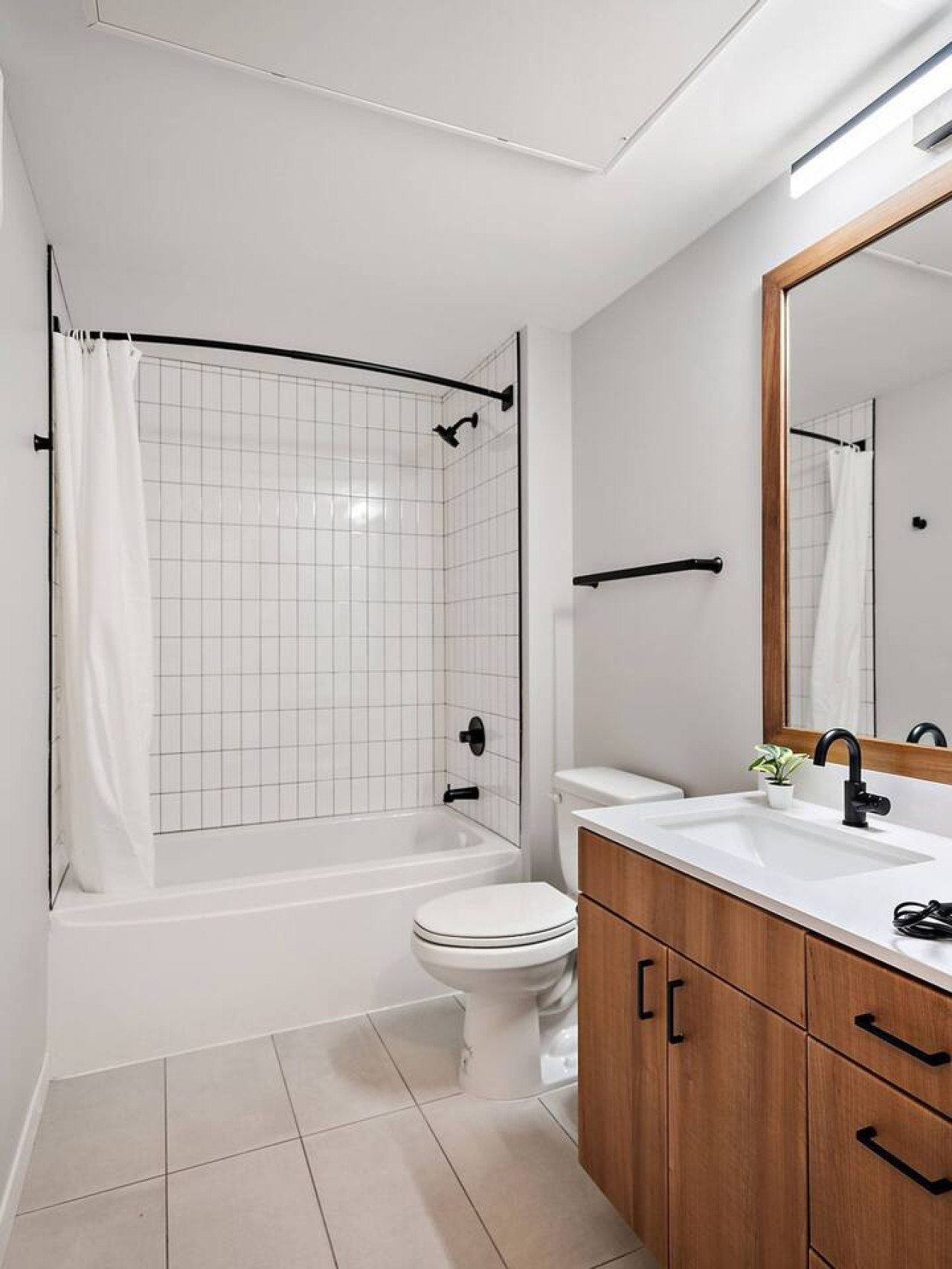 You feel a sense of calm as you enter the bathroom, where the thoughtful design and high-quality materials create a serene environment.