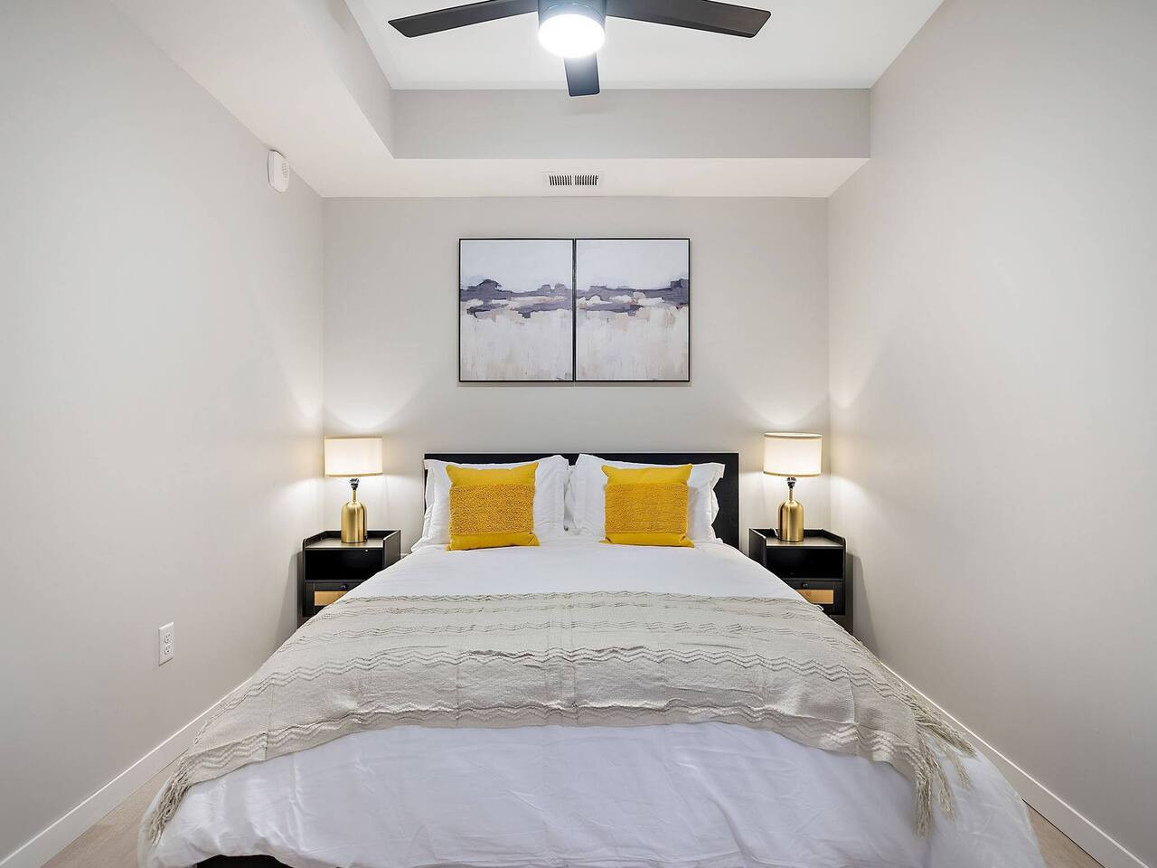 The bedroom offers a luxurious retreat, with a bed that promises restful nights and a room that feels like a private oasis.