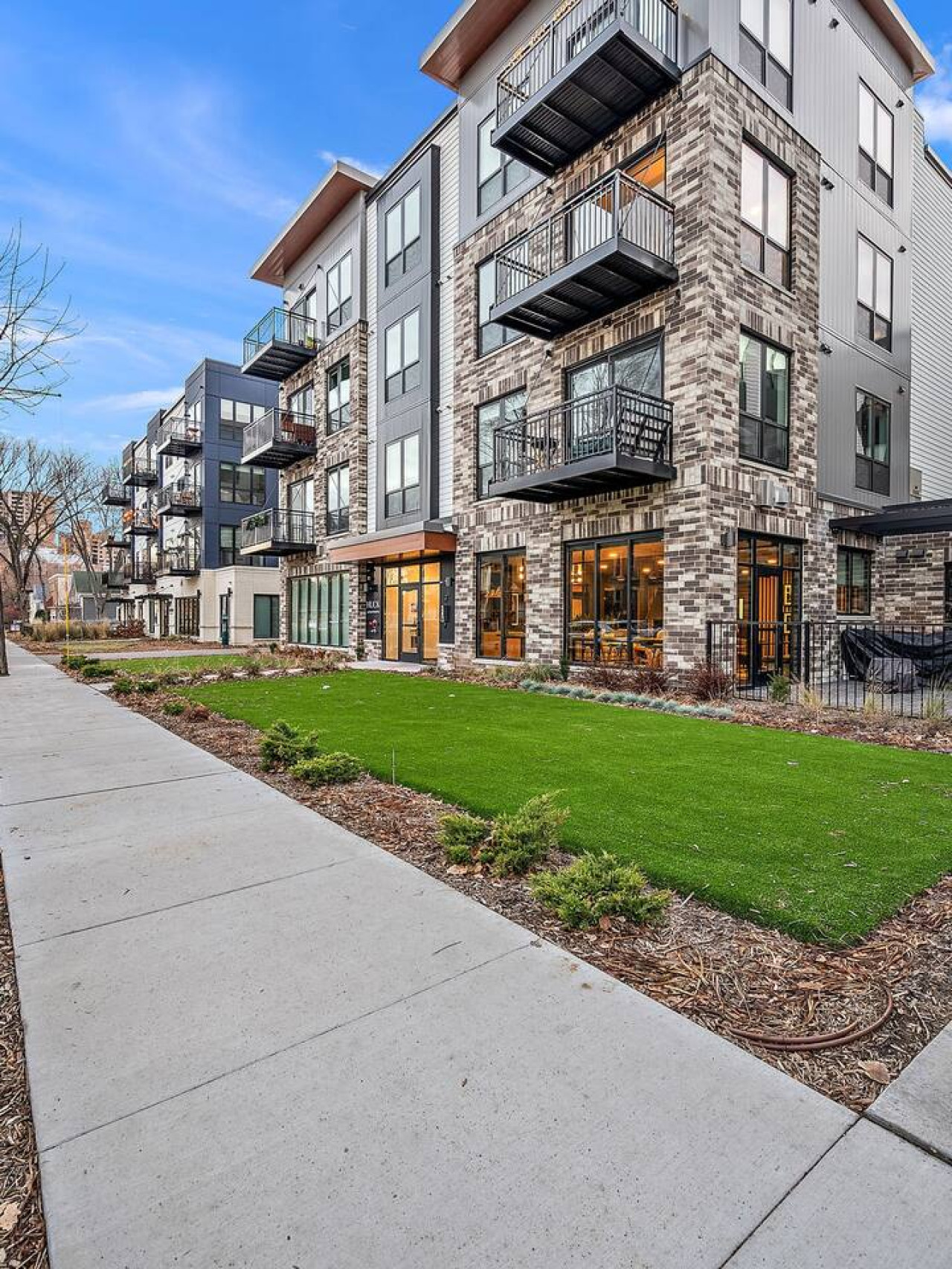The house’s exterior is a blend of modern and classic design elements, creating a welcoming and stylish facade.