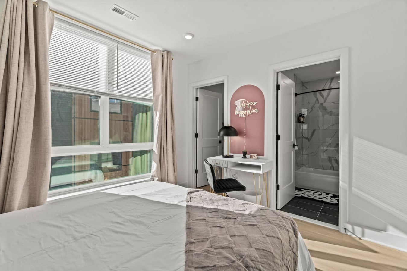 The bedroom’s serene ambiance invites you to relax, with a plush bed that promises a restful night's sleep.