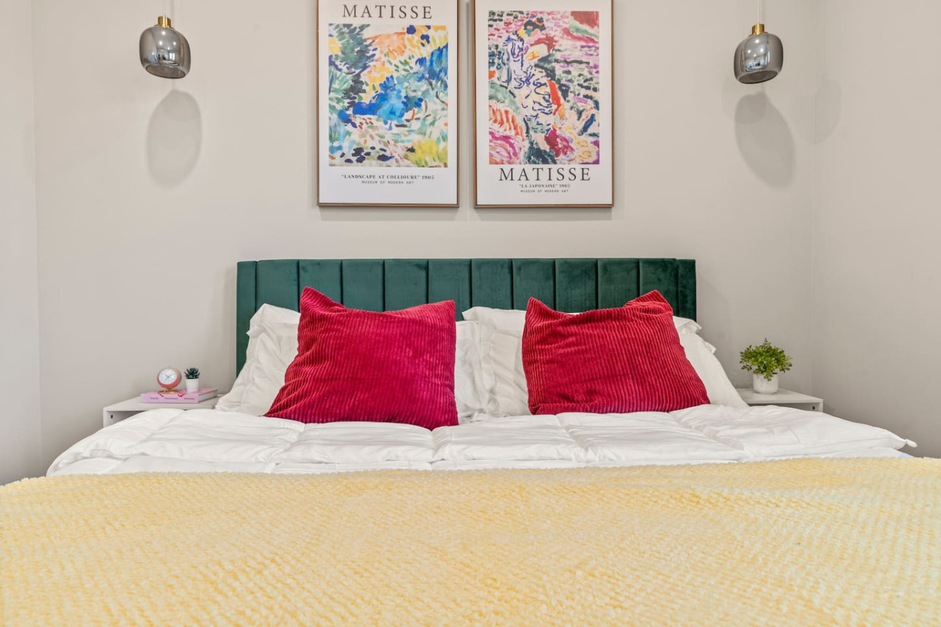 You feel enveloped in comfort as you relax on the queen bed, surrounded by a room designed for tranquility.