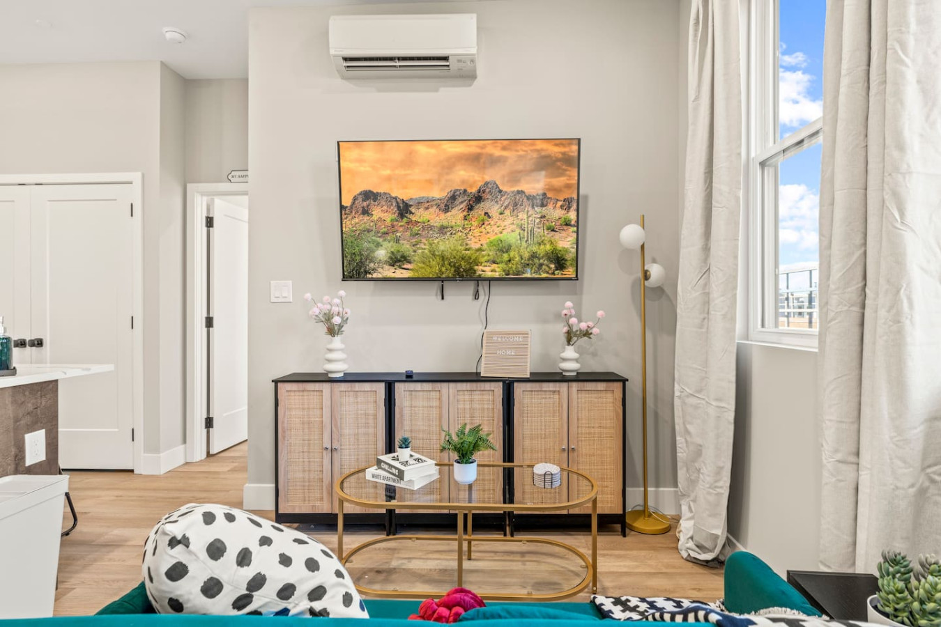 The living room’s cozy vibe makes it the perfect spot to relax, with ample seating and a warm ambiance.