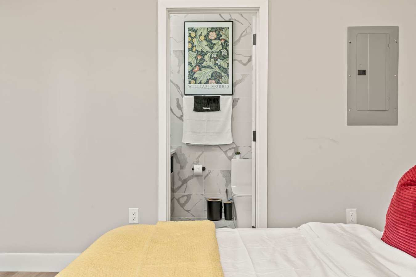 You feel enveloped in comfort as you relax on the queen bed, surrounded by a room designed for tranquility.