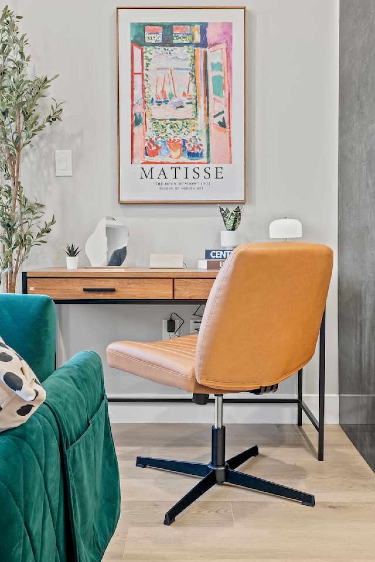 This cozy workspace with warm lighting, and a creative wall display, perfect for productivity.
