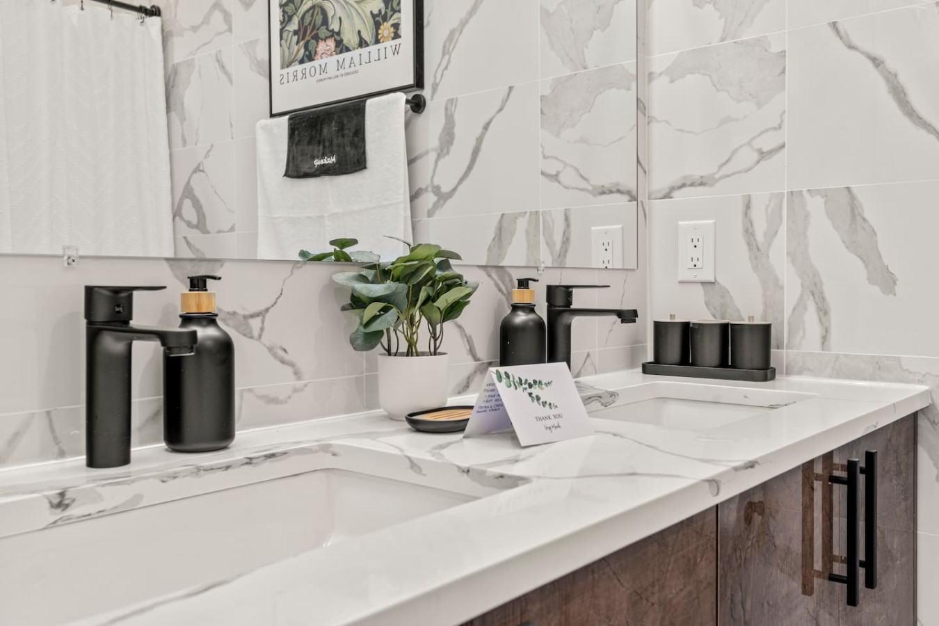 You feel a sense of calm as you enter the bathroom, where the thoughtful design and high-quality materials create a serene environment.
