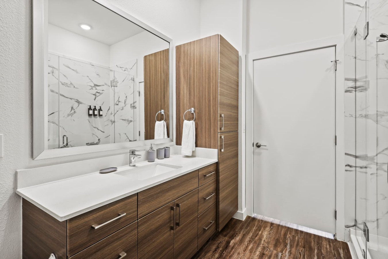 You feel a sense of calm as you enter the bathroom, where the thoughtful design and high-quality materials create a serene environment.