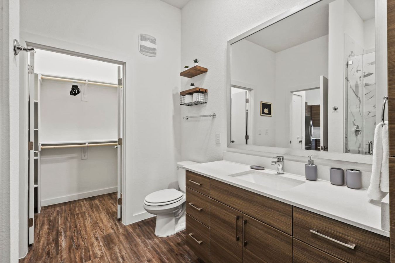 You feel a sense of calm as you enter the bathroom, where the thoughtful design and high-quality materials create a serene environment.