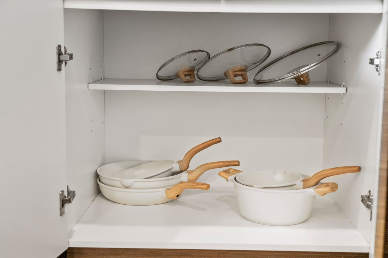 Kitchen cabinets stocked with cooking wares, glassware and silverwares, ideal for mixing up your favorite meals and drinks during your stay.