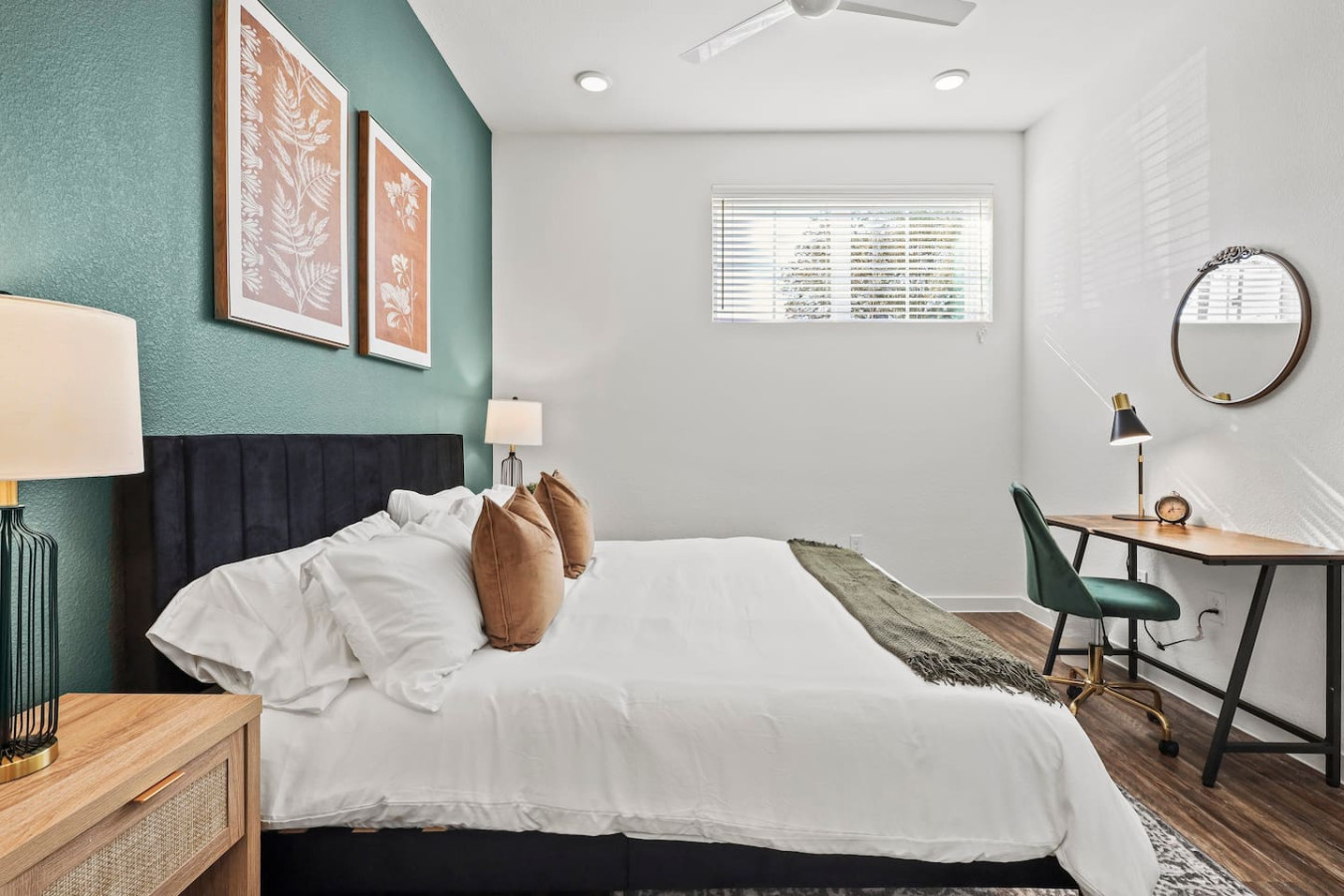 The bedroom offers a luxurious retreat, with a bed that promises restful nights and a room that feels like a private oasis.
