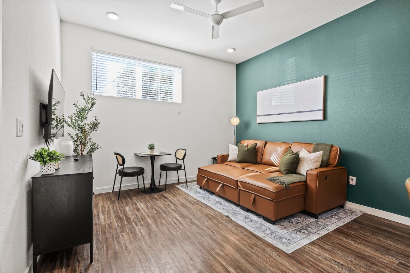 The living room is filled with natural light, creating a bright and welcoming space that invites relaxation.